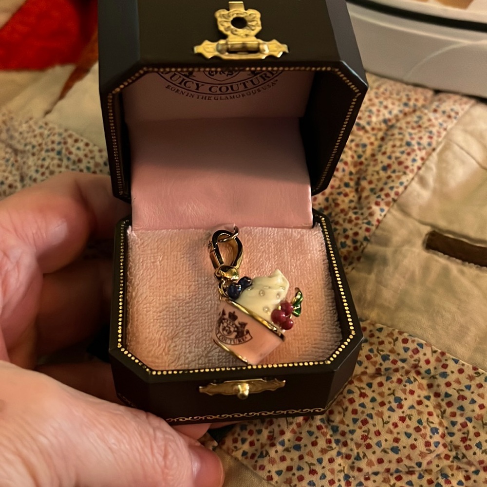 Juicy Couture jewelery charm. In original box.